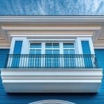 Freshly painted blue coastal home exterior illustrating how long does exterior paint last in James Island’s climate