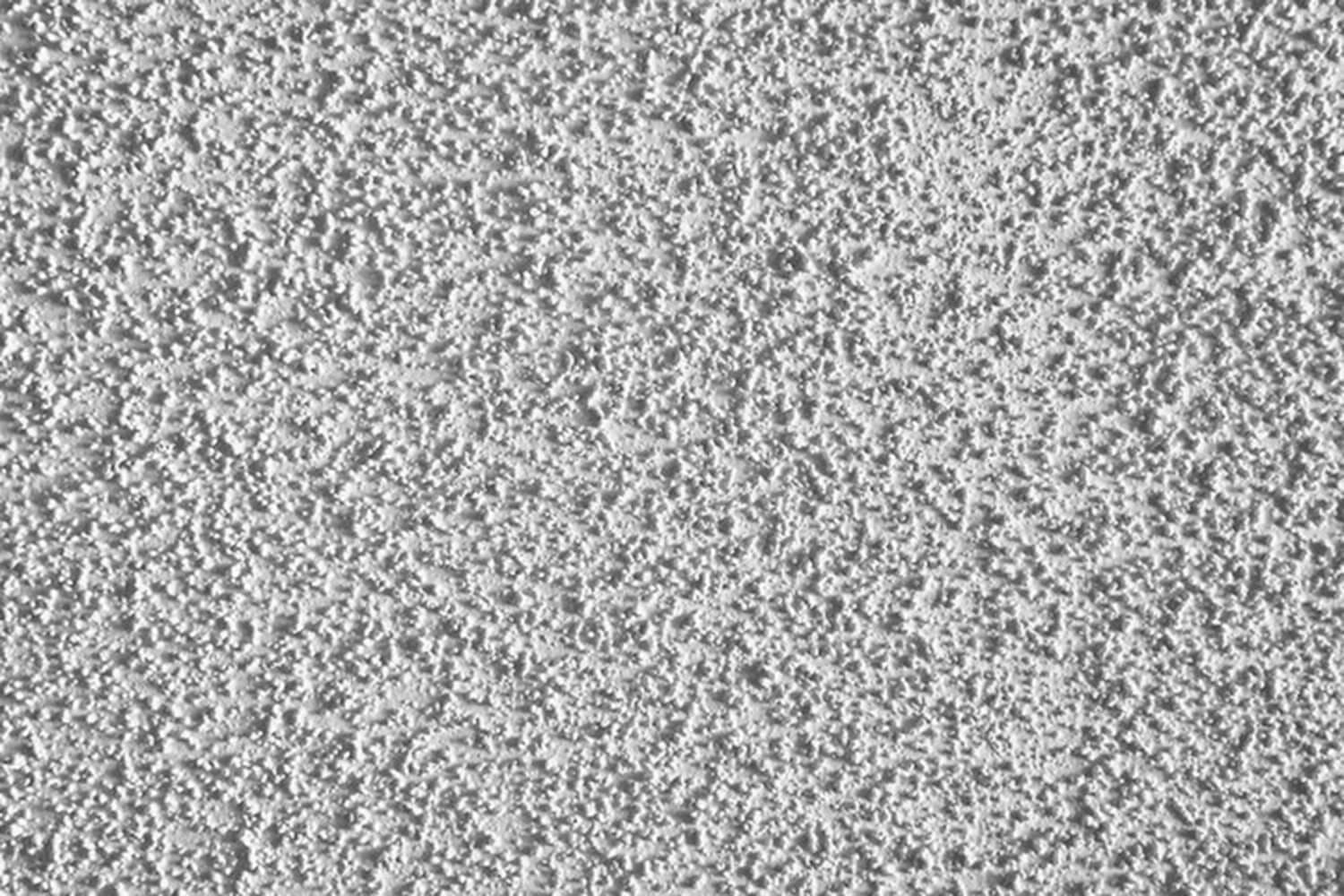 Close-up of a popcorn ceiling texture showing the rough surface homeowners consider when deciding should you remove or paint over popcorn ceilings